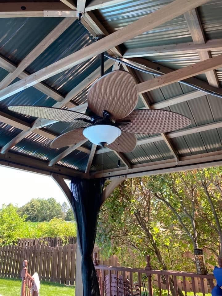 Ceiling fan installed beneath a covered outdoor patio