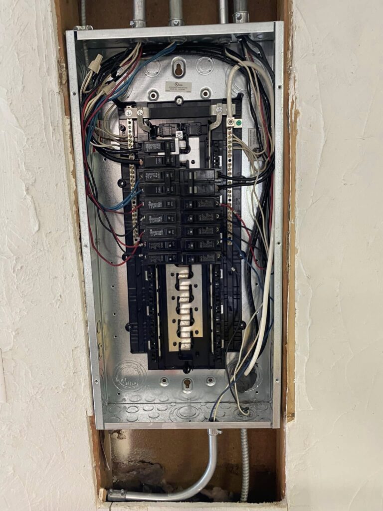 Residential circuit breaker panel opened for electrical service work