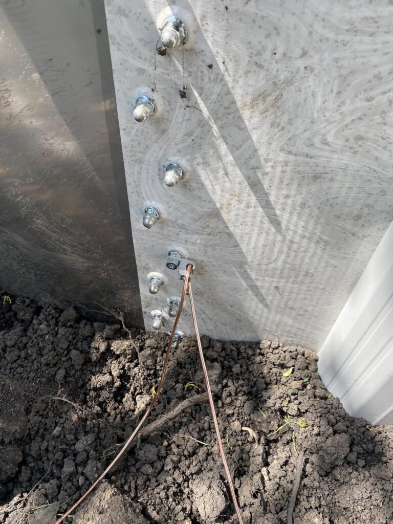 Close-up of an electrical bonding connection on an above-ground pool