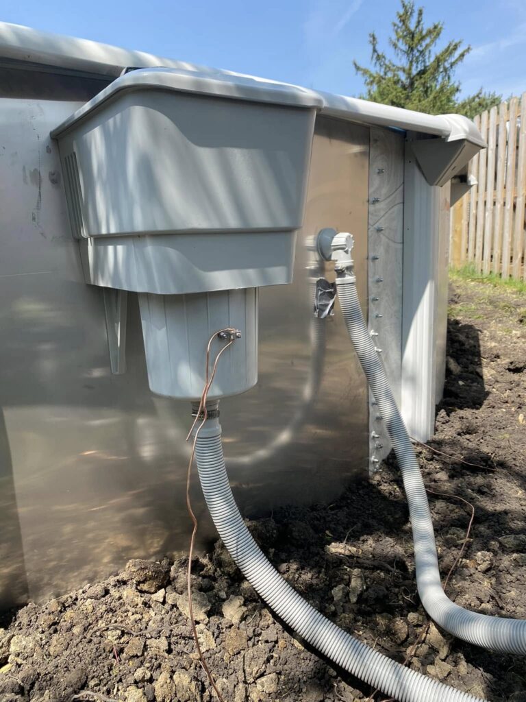Weatherproof electrical connection installed beside an above-ground pool
