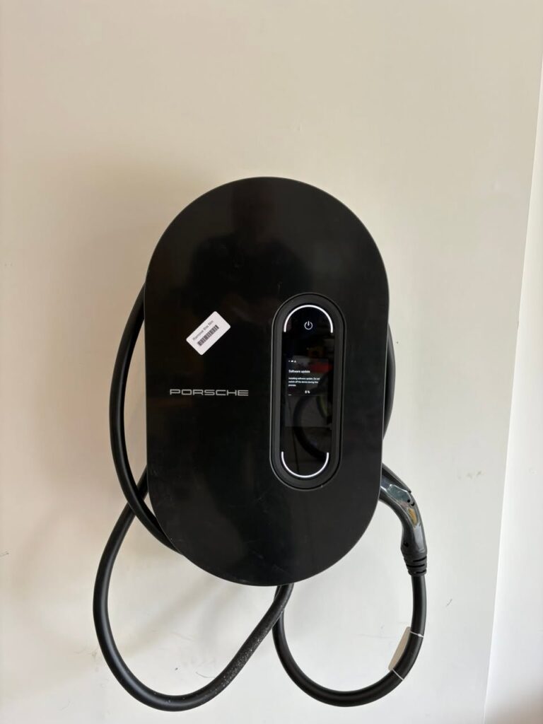 Wall-mounted electric vehicle charger installed in a residential garage