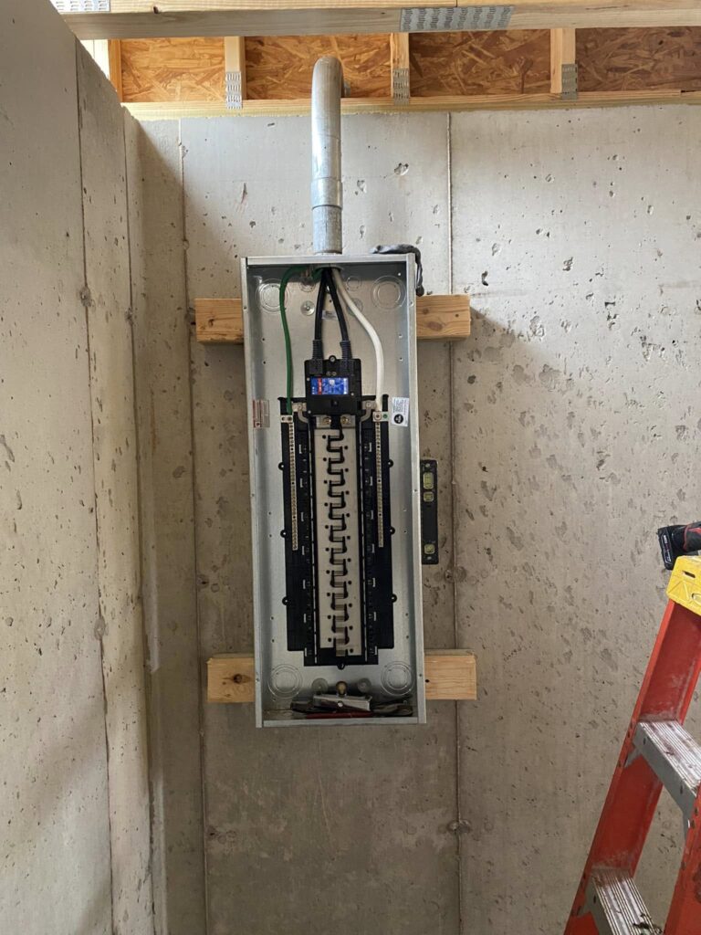 Residential electrical subpanel installed on a basement wall