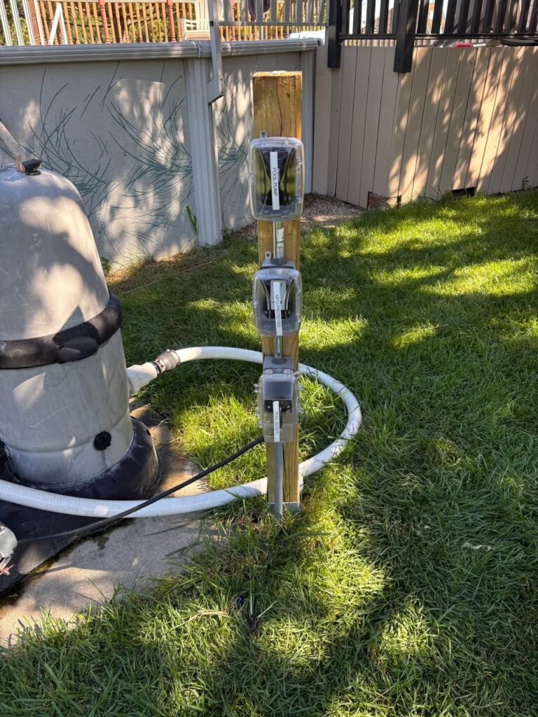 Outdoor electrical disconnects installed for residential pool equipment